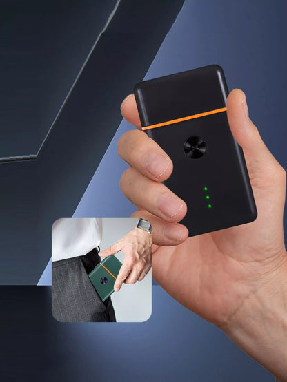 Black and orange portable mini shaver by Trendsi, compact size with a sleek design for on-the-go grooming.