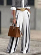Black high-waisted wide-leg striped pants by Trendsi, featuring a stylish silhouette and bold vertical stripe pattern.