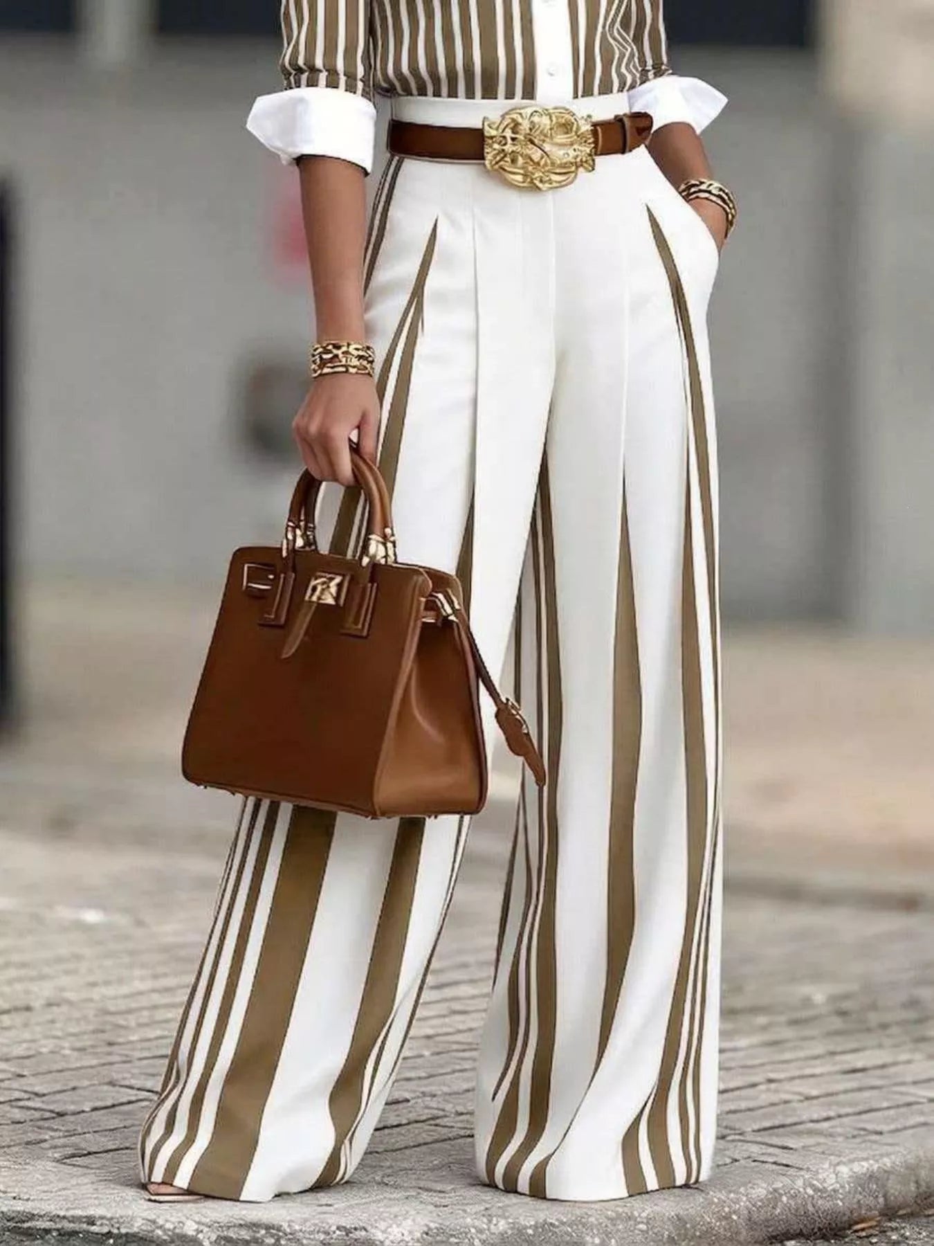 Black high-waisted wide-leg striped pants from Trendsi, styled with a relaxed fit and bold vertical stripe pattern.