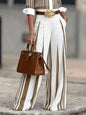 Black high-waisted wide-leg striped pants from Trendsi, styled with a relaxed fit and bold vertical stripe pattern.