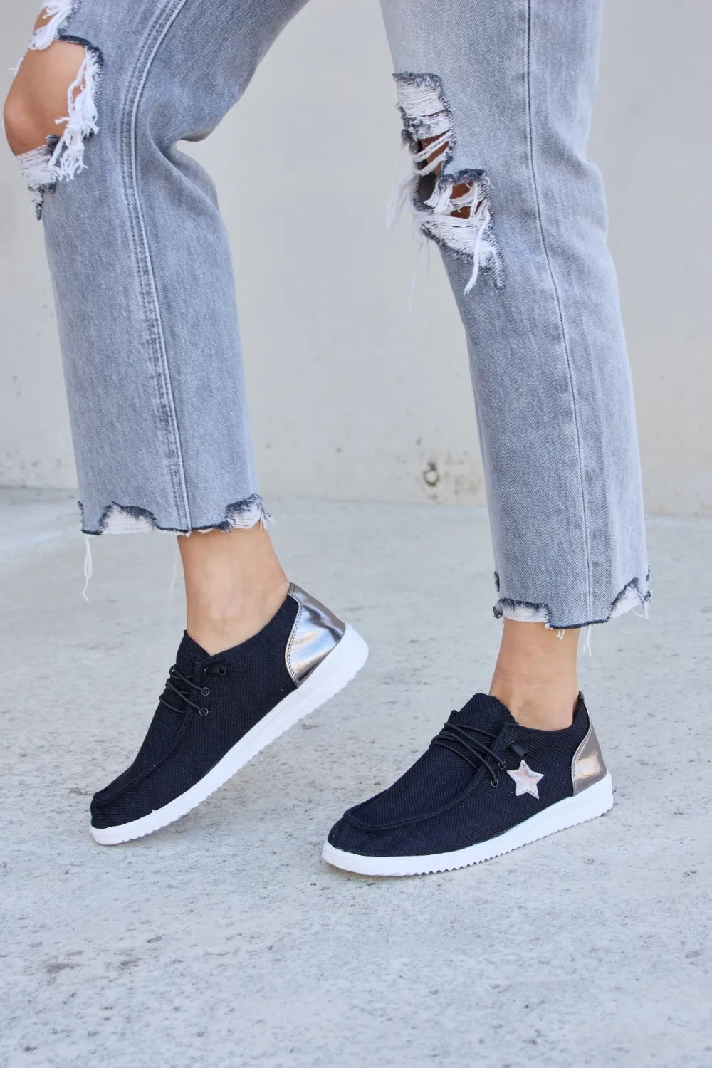 Black Forever Link Star lace-up flat sneakers by Trendsi with star details and comfortable flat sole.