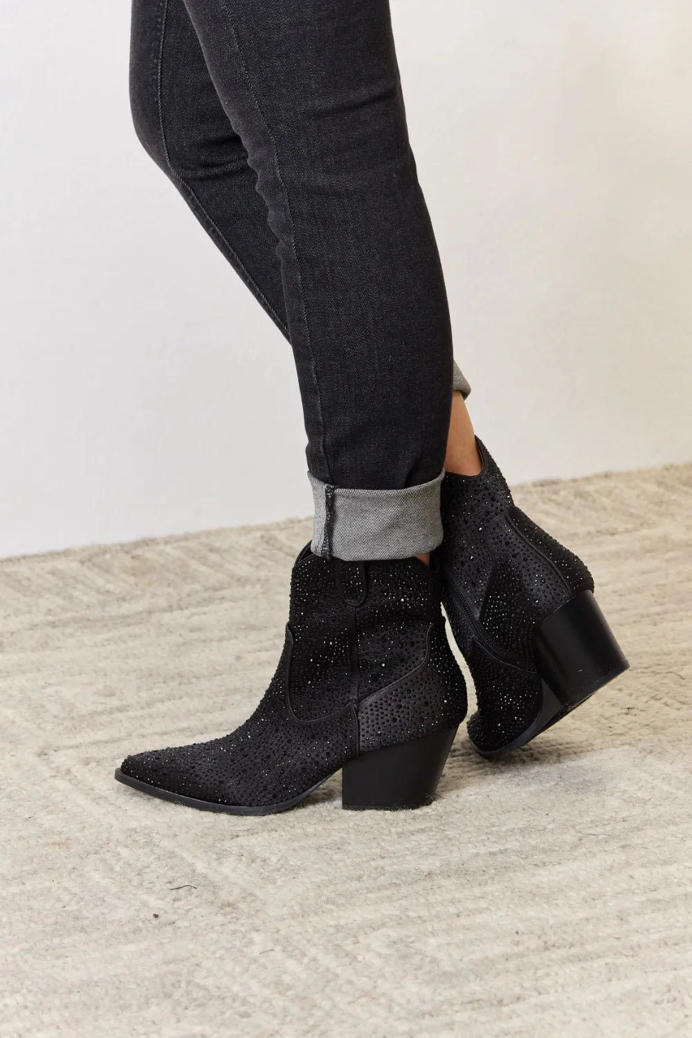 Black rhinestone ankle cowboy boots by East Lion Corp featuring western style and embellished with sparkling rhinestones.