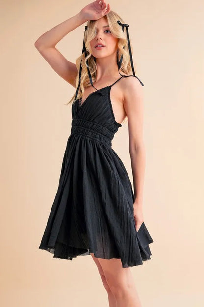Black Aemi+Co lace detail mini cami dress with thin straps and fitted silhouette, stylish and perfect for summer wear.