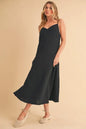 Black Aemi+Co side button midi cami dress by Trendsi, featuring a sleeveless design, button details, and a midi length.