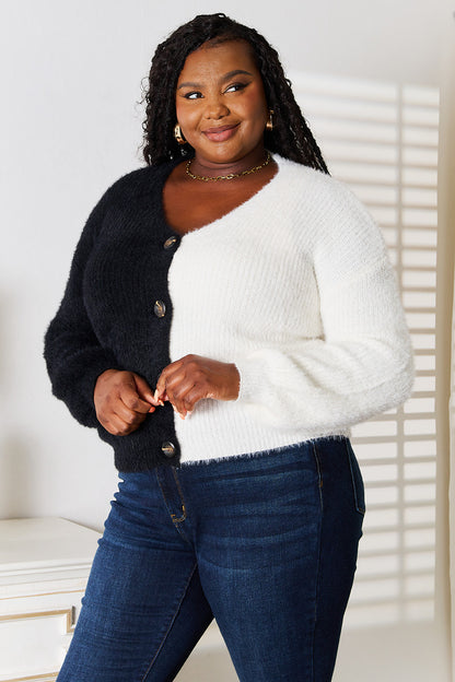 Black angel wings woven cardigan with contrast buttons, V-neck, and right-side embroidery, stylish and cozy for casual wear.