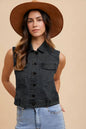 Black Annie Wear denim vest with collared neck and button-down front, styled with visible stitching and a casual fit.