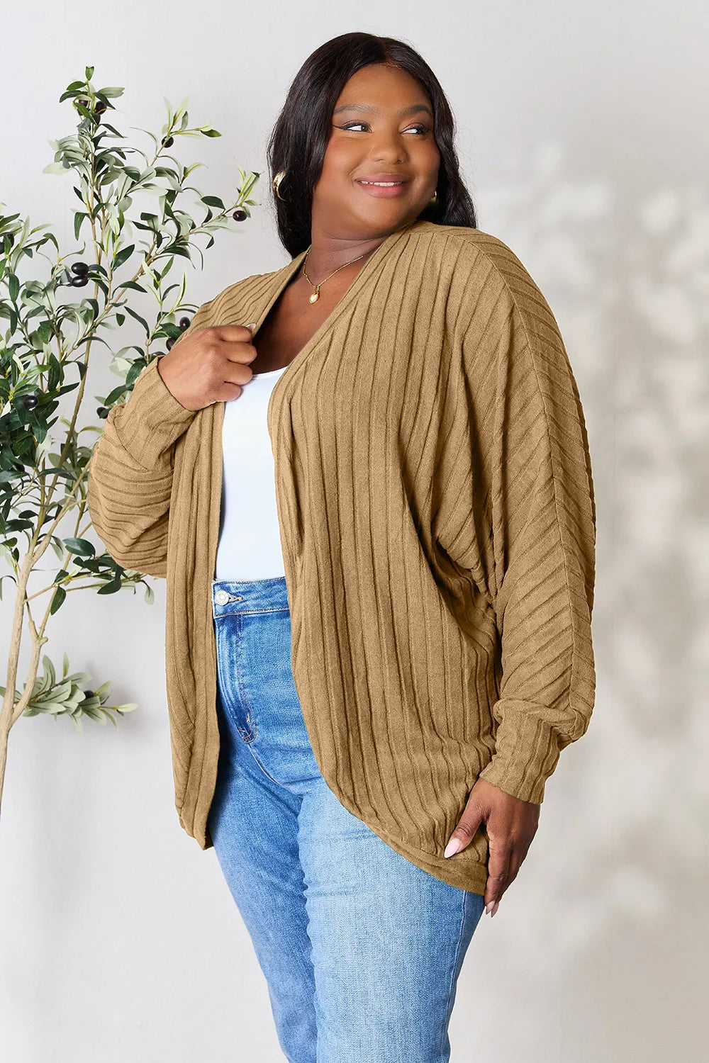 Black Trendsi Basic Bae full-size ribbed cocoon cardigan draped on a hanger with a cozy, relaxed fit.