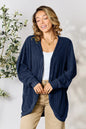 Black Basic Bae full-size ribbed cocoon cardigan by Trendsi, featuring a cozy, oversized knit design with a relaxed fit.