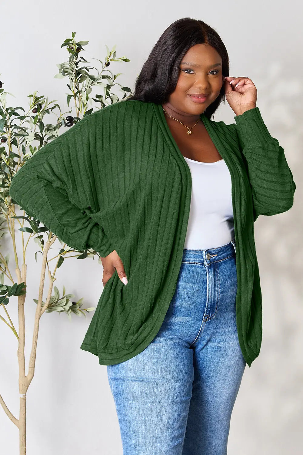 Black Trendsi Basic Bae full-size ribbed cocoon cardigan displayed on a model, showcasing its cozy, oversized fit and textured knit fabric.