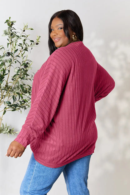 Black Basic Bae Full Size Ribbed Cocoon Cardigan by Trendsi, featuring a cozy, oversized fit with ribbed knit texture.