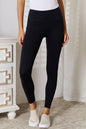 Black Basic Bae wide waistband sports leggings by Trendsi, showing a close-up of the high-rise elastic waistband and stretchy fabric.