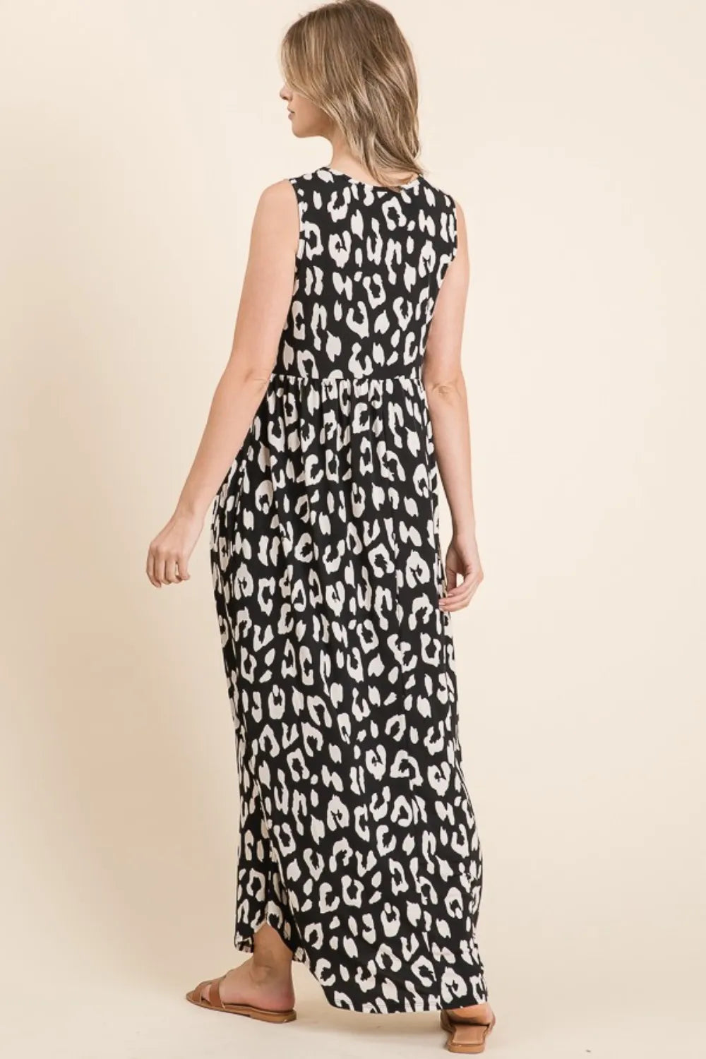Black Leopard Maxi Dress with Pockets by Trendsi, featuring a flowing silhouette and stylish design.