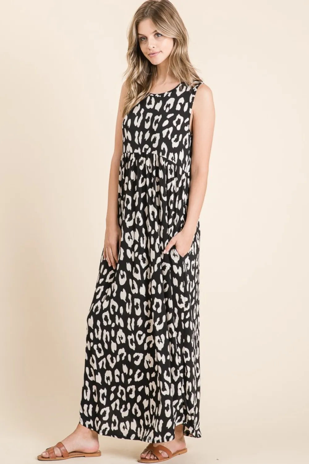 Black BOMBOM Leopard Maxi Dress by Trendsi with pockets, featuring a stylish leopard print and flowing maxi length.