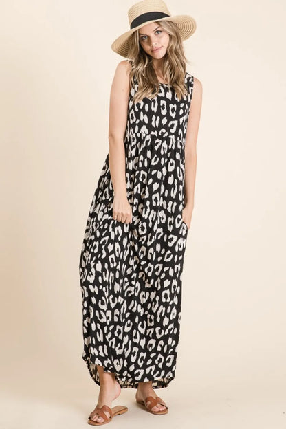 Black BOMBOM Leopard Maxi Dress with Pockets by Trendsi, featuring a flowy silhouette and stylish side pockets.