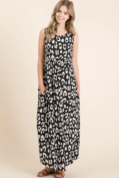 Black BOMBOM Leopard Maxi Dress with Pockets by Trendsi, featuring a flowing silhouette and stylish animal print.