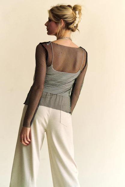 Black Davi & Dani sparkly rhinestone sheer mesh round neck top with long sleeves, stylish and semi-transparent for a trendy look.