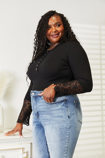 Black Trendsi Double Take crochet lace hem sleeve button top, featuring long sleeves and intricate lace detailing.
