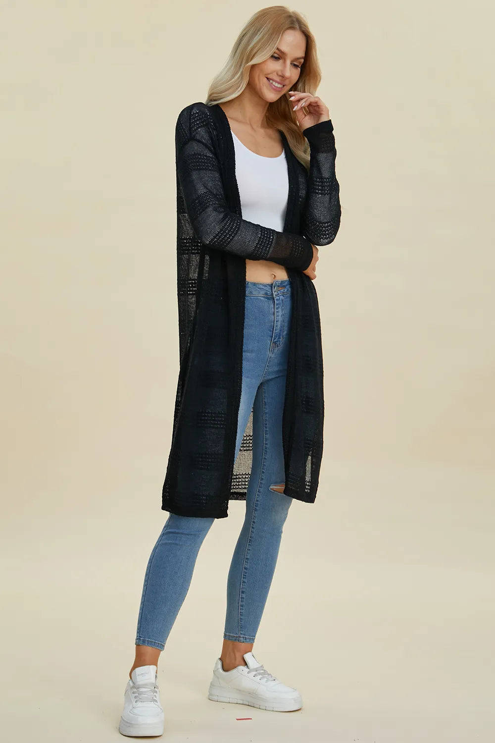 Black Trendsi Double Take open front longline cardigan displayed hanging with a relaxed fit and long sleeves.