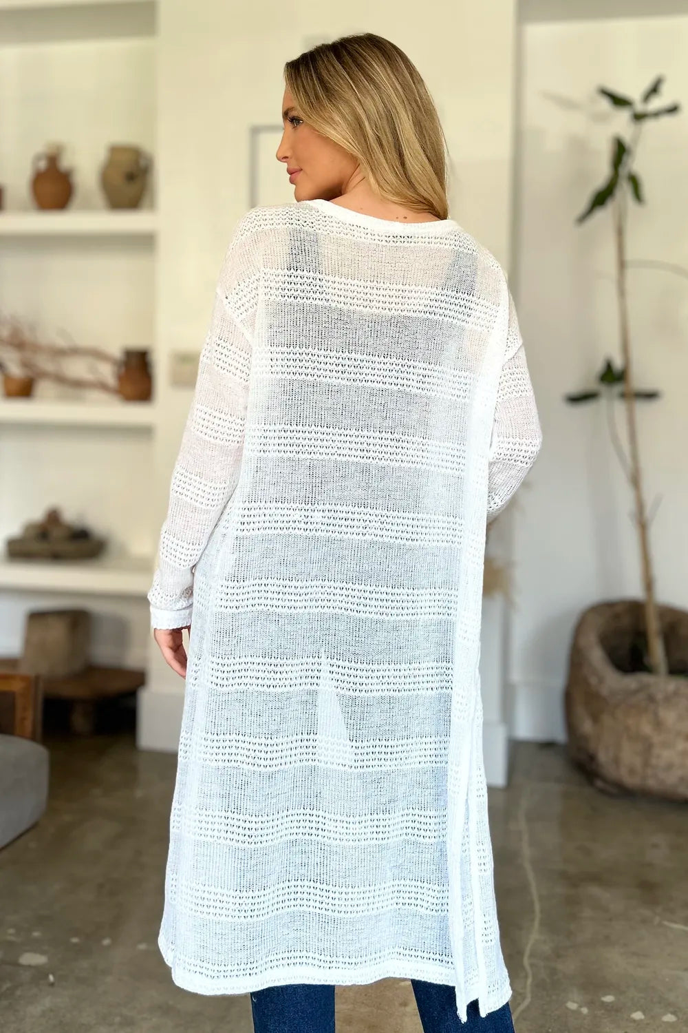 Black Trendsi Double Take full-size open front longline cardigan displayed on a model, showcasing its relaxed fit and draped style.