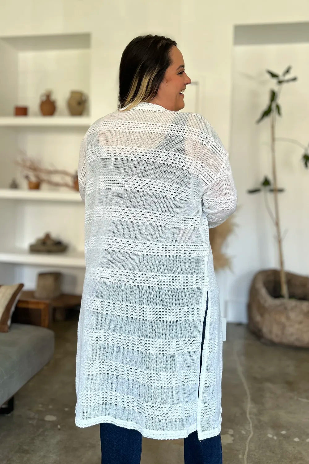 Black Trendsi Double Take full-size open front longline cardigan displayed on a model with a relaxed fit and soft fabric texture.