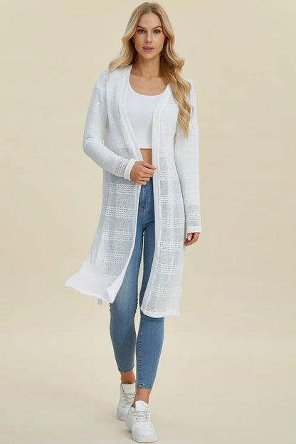 Black Trendsi Double Take full-size open front longline cardigan hanging on a clothing rack.