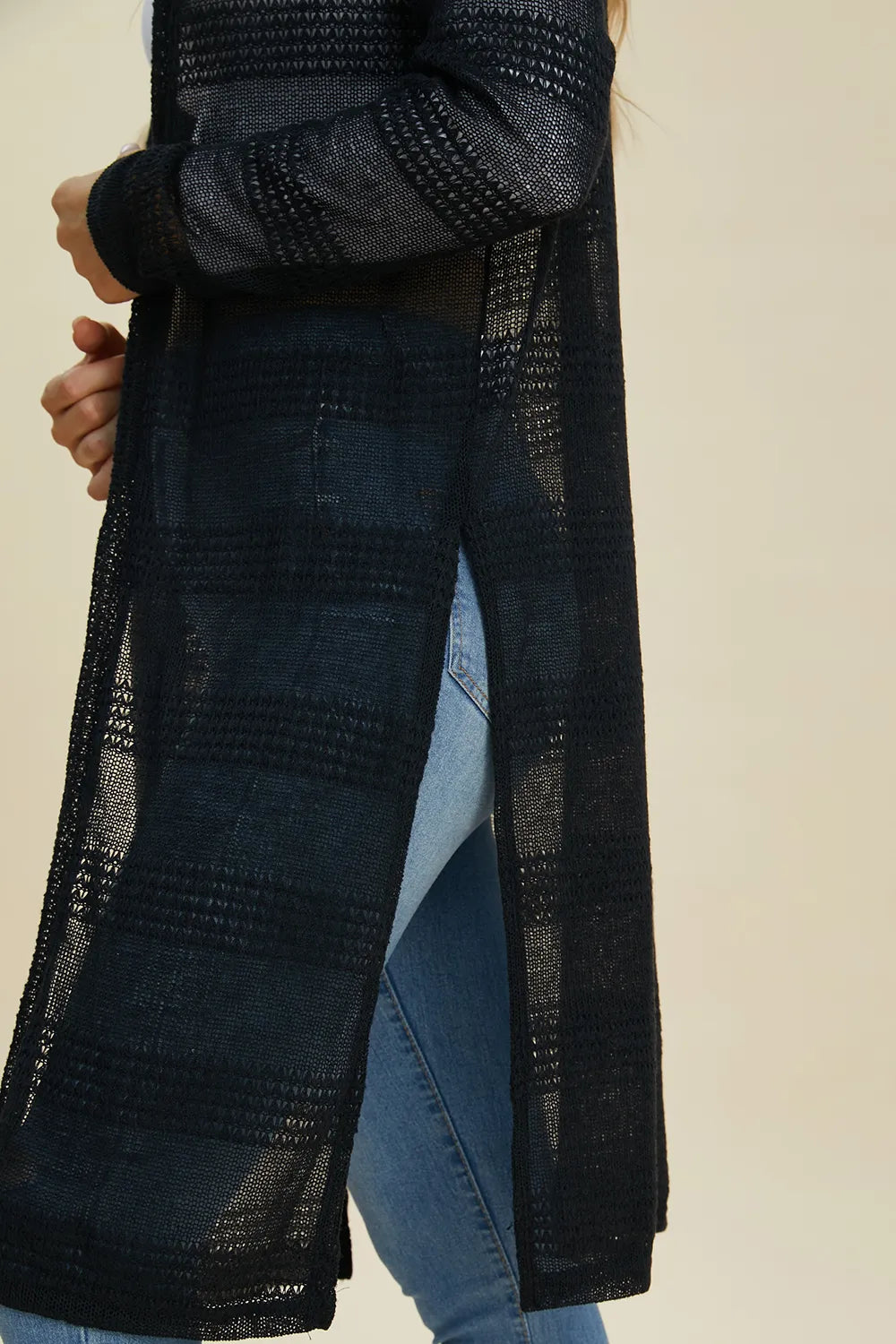 Black Trendsi Double Take full-size open front longline cardigan displayed on a model, showcasing its relaxed fit and longline design.