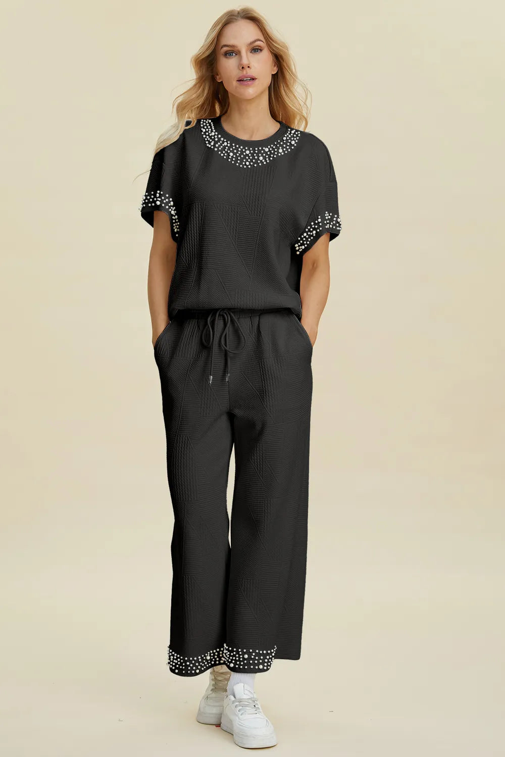 Black double take set with pearl details, includes round neck top and matching pants, trendy and stylish for casual wear.