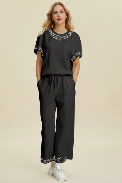 Black double take set with pearl details, includes round neck top and matching pants, trendy and stylish for casual wear.