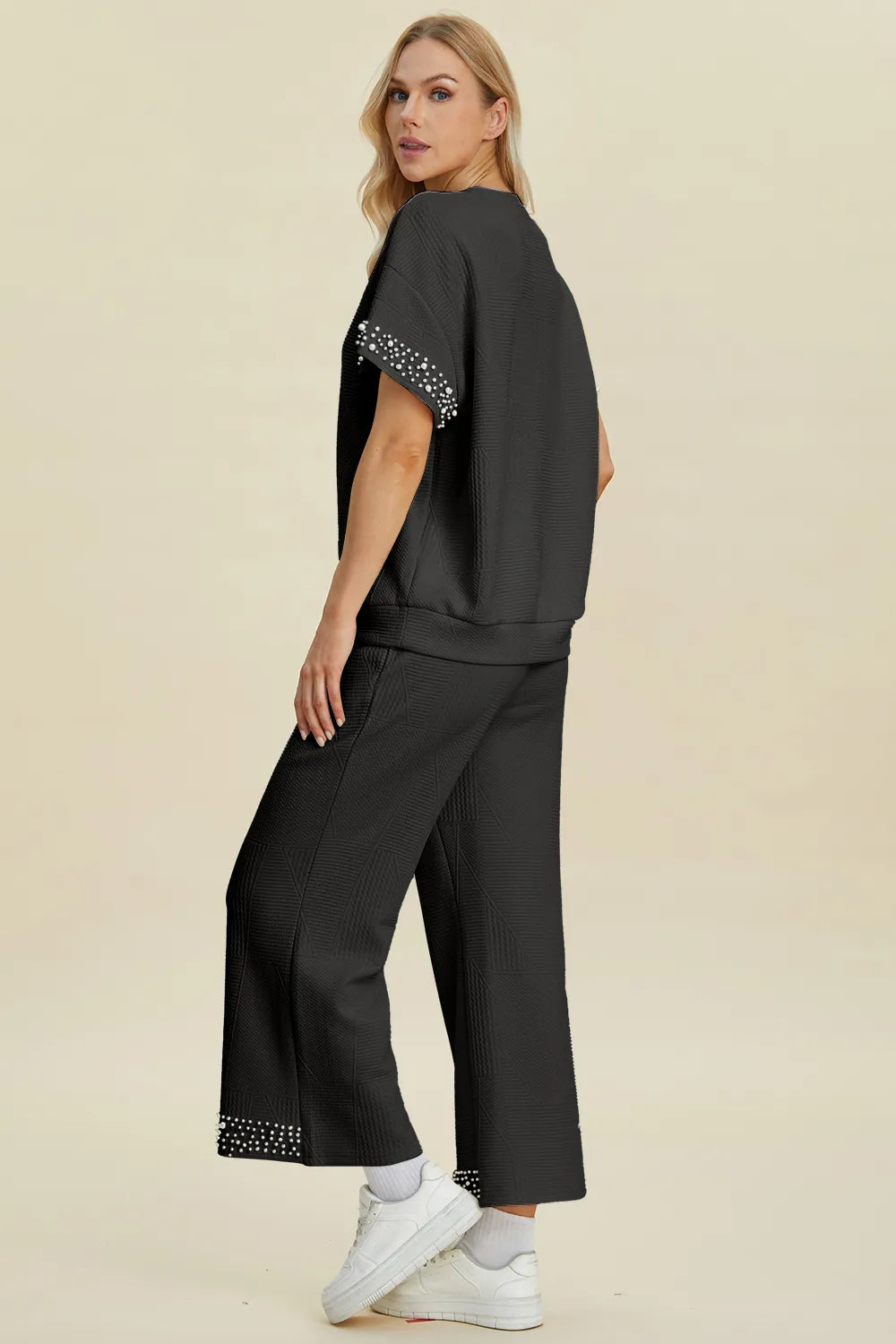 Black double take pearl detail round neck top and matching pants set by Trendsi, stylish and comfortable for casual wear.