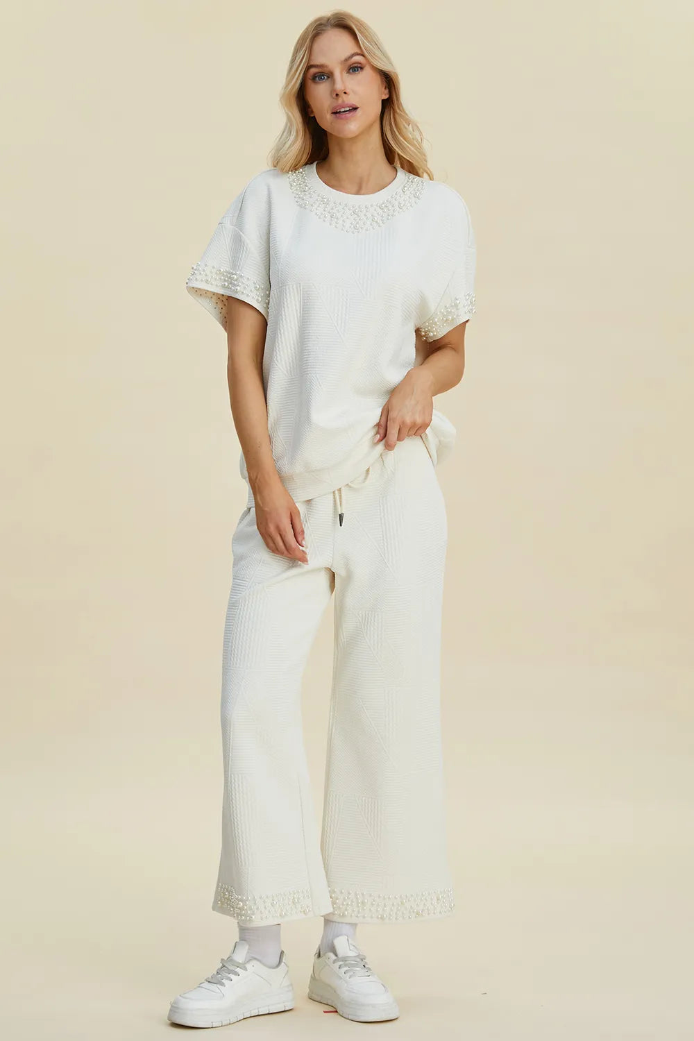 Black double take pearl detail round neck top and matching pants set from Trendsi, stylish full-size women's outfit.