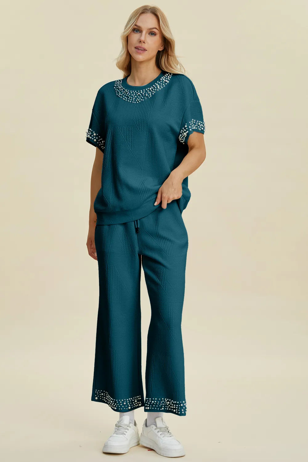 Black double take pearl detail round neck top and matching pants set by Trendsi, stylish full-size women's outfit.