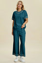 Black double take pearl detail round neck top and matching pants set by Trendsi, stylish full-size women's outfit.
