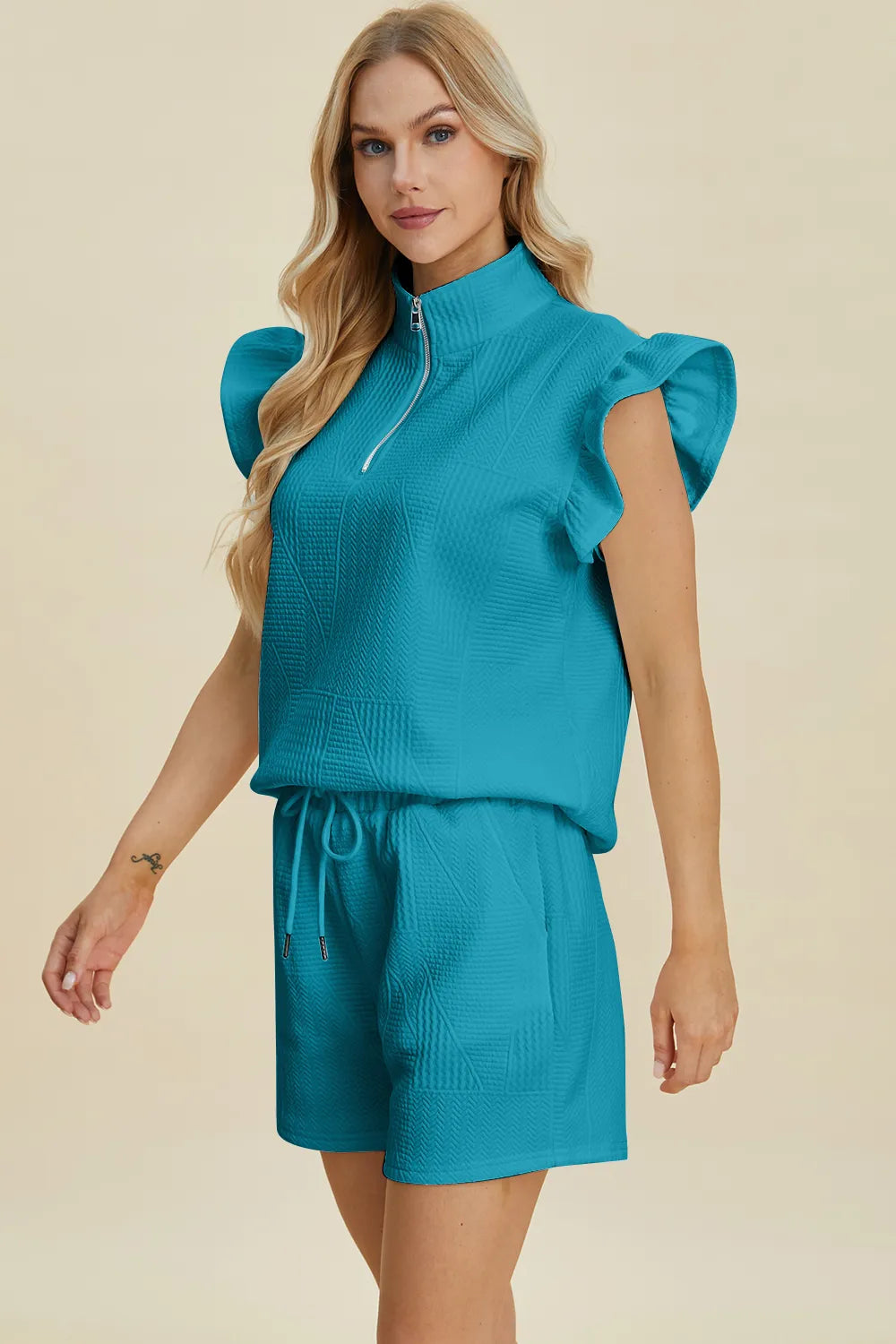 Black Trendsi double take texture flounce sleeve top and matching shorts set, stylish and comfortable for casual wear.
