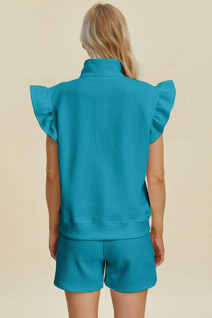Black Trendsi Double Take texture flounce sleeve top and shorts set, featuring stylish flounce sleeves and a coordinated summer look.