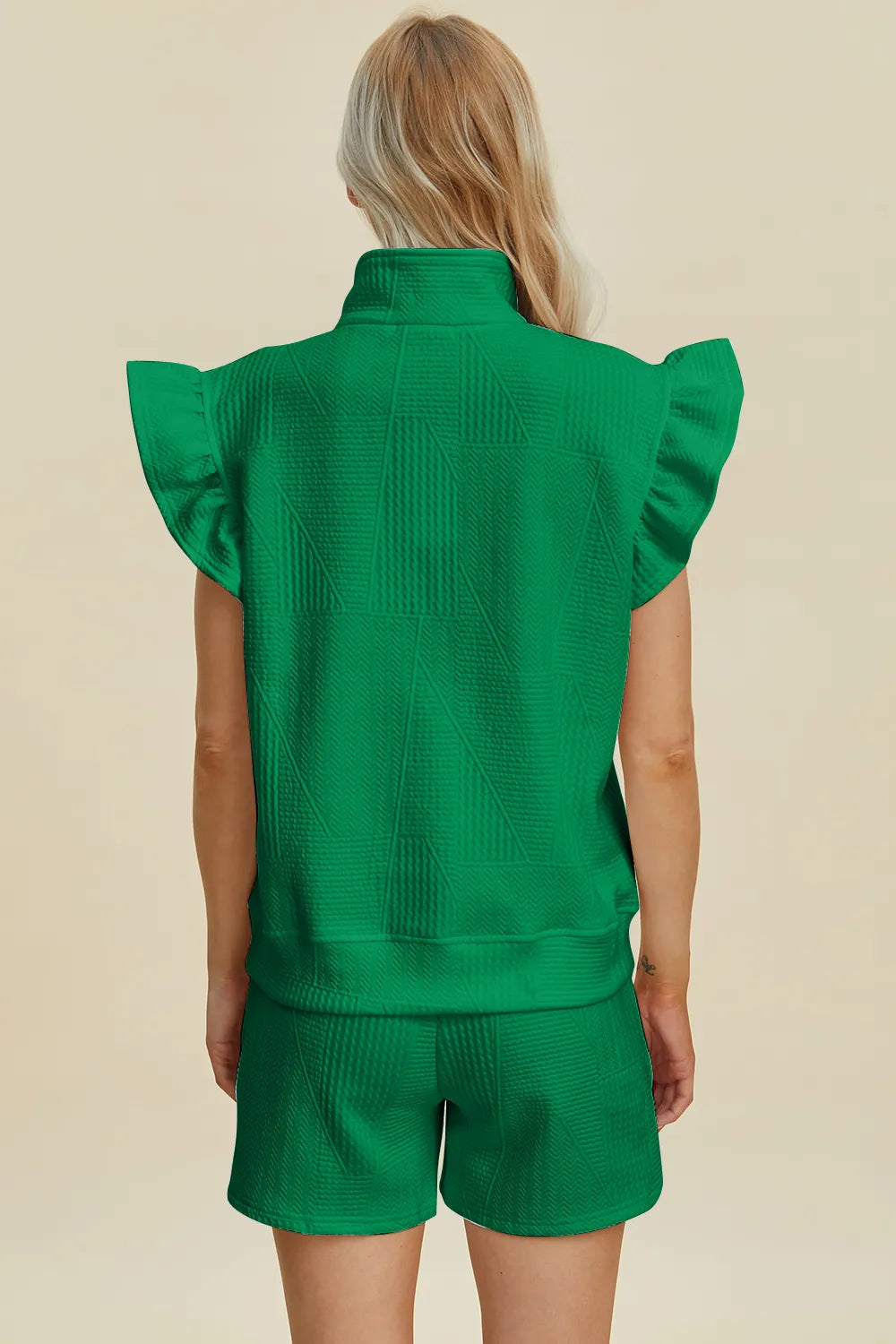 Black double take set featuring a textured flounce sleeve top and matching shorts from Trendsi.