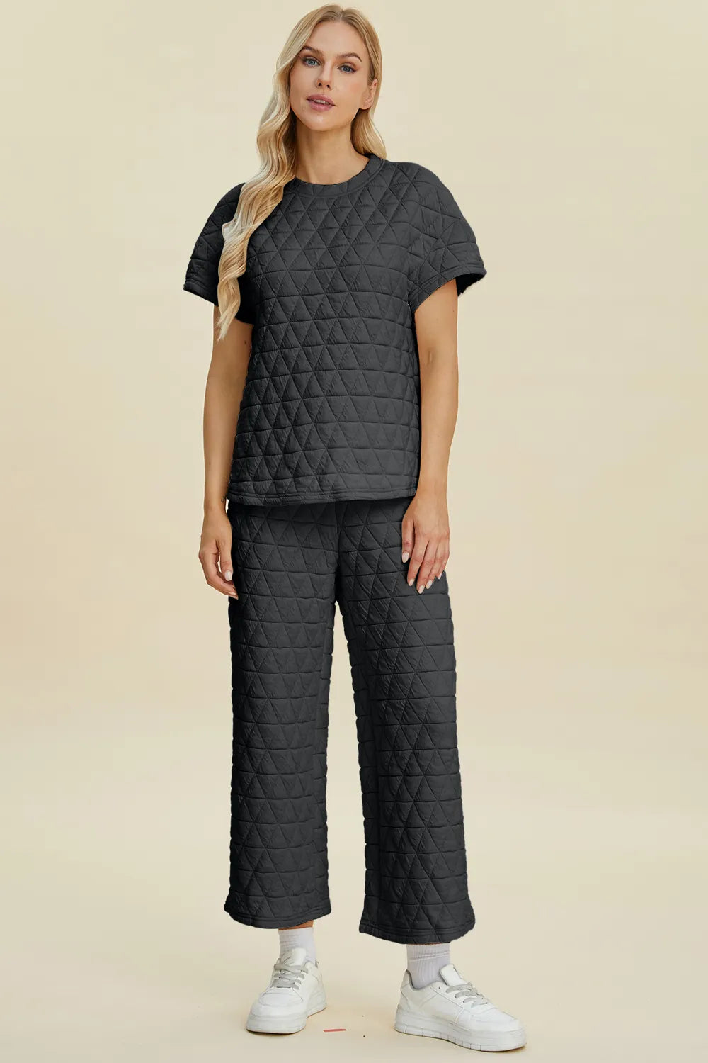 Black Trendsi Double Take texture round neck short sleeve top and matching pants set, casual and comfortable for everyday wear.