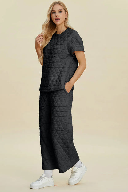 Black double take full size texture round neck short sleeve top and matching pants set by Trendsi, casual and comfortable outfit.