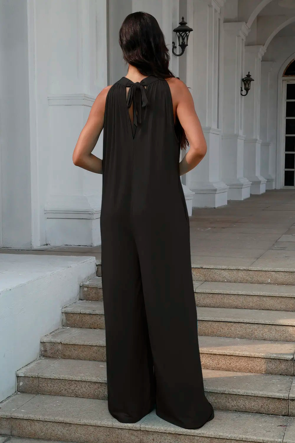 Black Trendsi double take sleeveless jumpsuit with cutout details and a tie-back design, full size, perfect for stylish occasions.