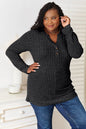 Black Trendsi Double Take Notched Neck ribbed long sleeve T-shirt, close-up of the ribbed fabric and stylish notched neckline.