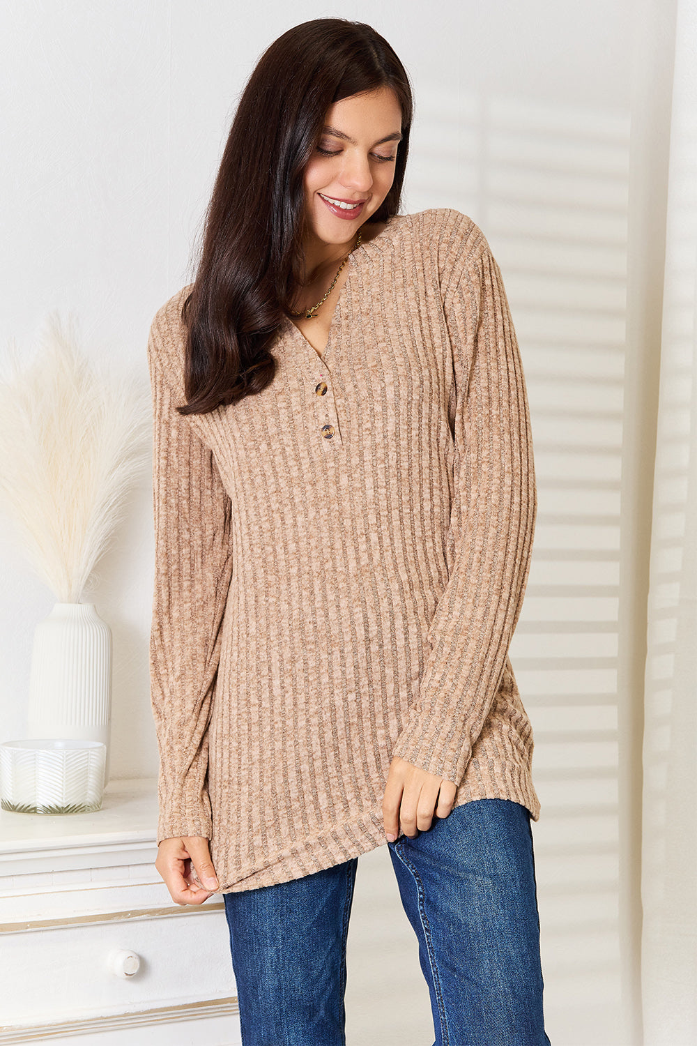 Black ribbed long sleeve T-shirt with a notched neckline from Trendsi, featuring a fitted design and long sleeves.