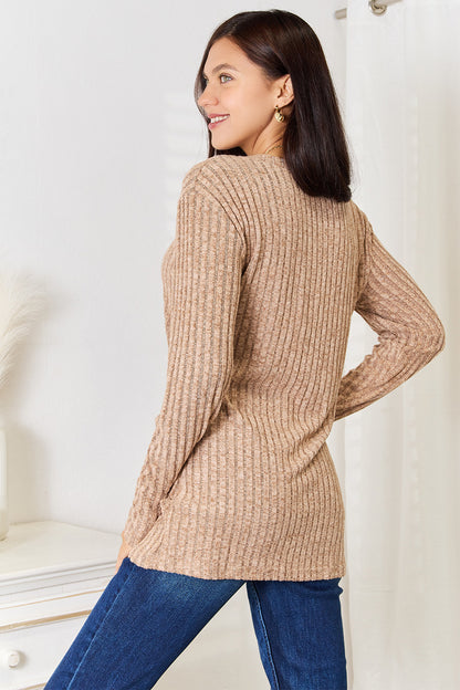 Black ribbed long sleeve T-shirt with a notched neck from Trendsi, featuring a fitted, stylish design.