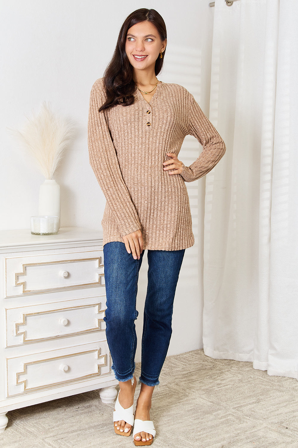 Black Trendsi Double Take notched neck ribbed long sleeve T-shirt, close-up of the fitted, ribbed fabric and stylish neckline.