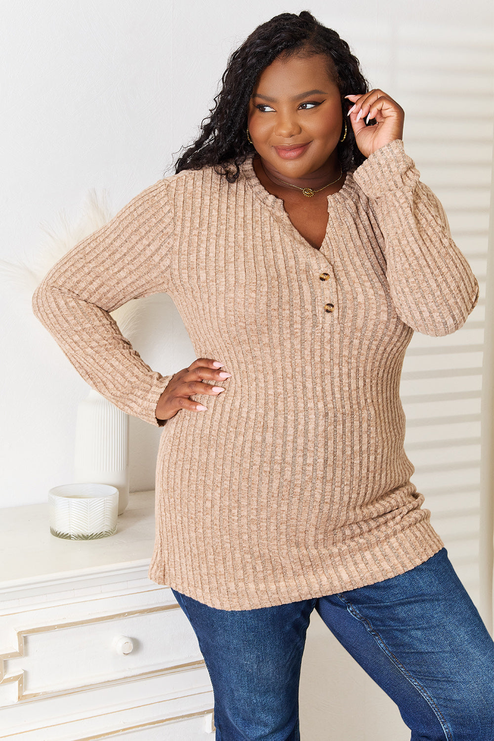 Black ribbed long sleeve T-shirt with a notched neckline from Trendsi, featuring a fitted design and long sleeves.