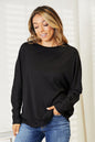 Black Trendsi Double Take seam detail round neck long sleeve top, close-up view showing the fabric and seam accents.