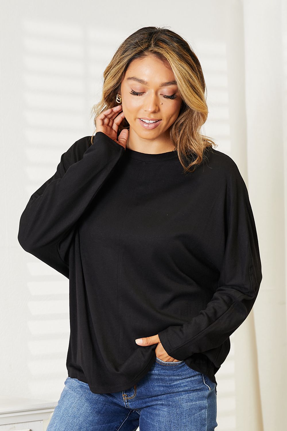 Black Trendsi double take seam detail round neck long sleeve top, showcasing the stylish seam accents and comfortable fit.