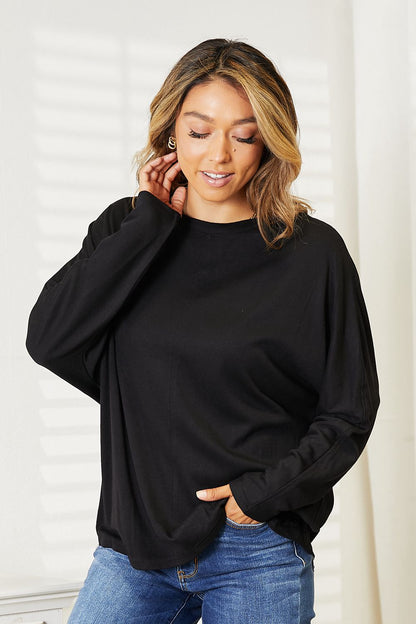 Black Trendsi double take seam detail round neck long sleeve top, showcasing the stylish seam accents and comfortable fit.