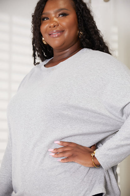 Black Trendsi Double Take seam detail round neck long sleeve top, close-up showing fabric texture and seam accents.