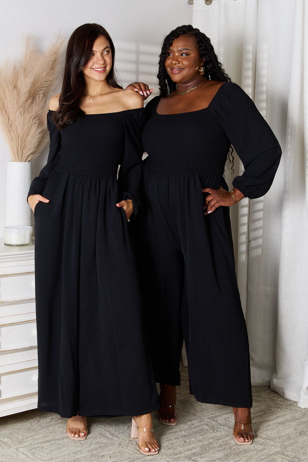 Black Trendsi Double Take square neck jumpsuit with pockets, featuring a fitted bodice and wide-leg pants for a stylish look.