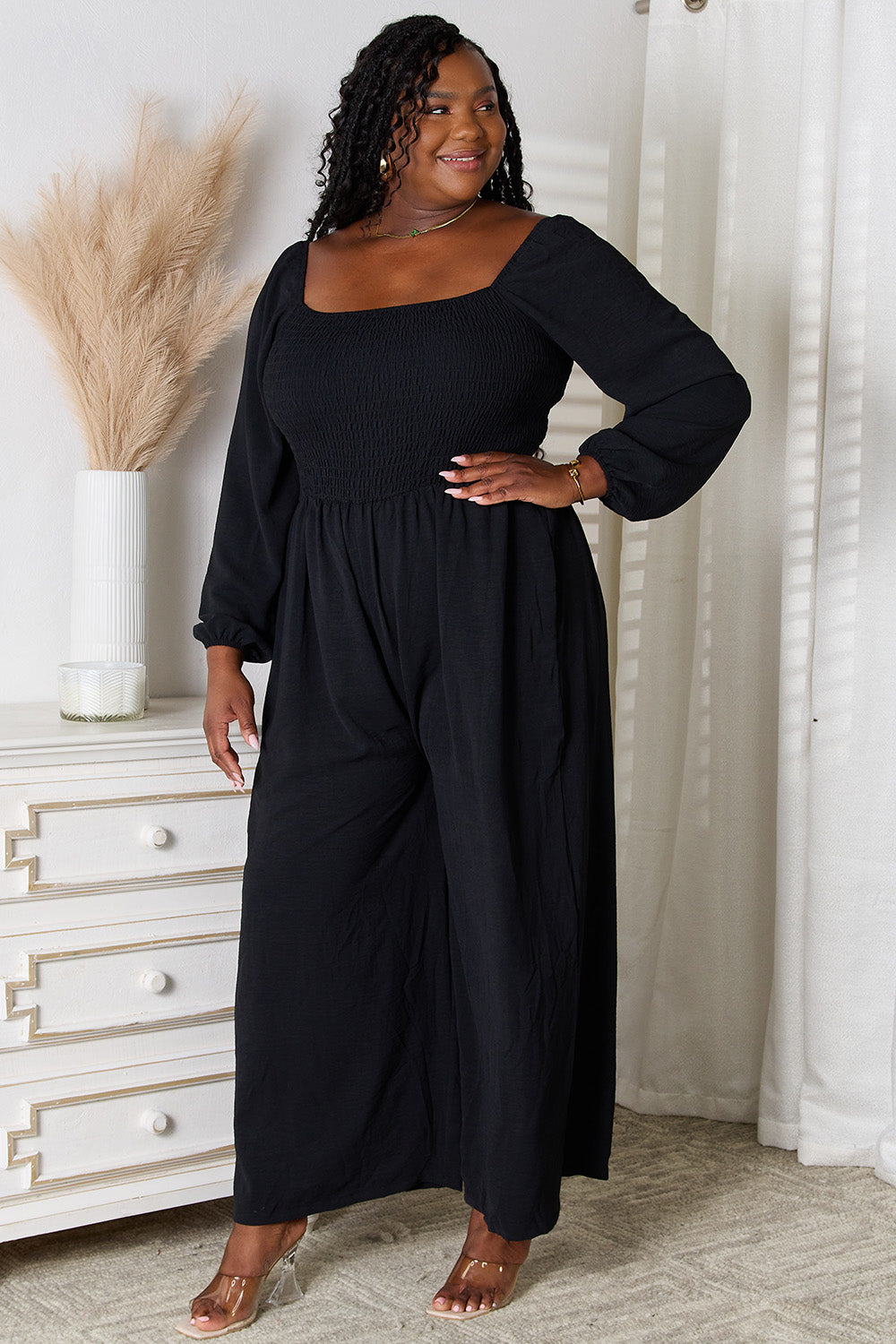 Black Trendsi Double Take Square Neck Jumpsuit with pockets, fitted silhouette, and sleeveless design, perfect for casual or chic occasions.