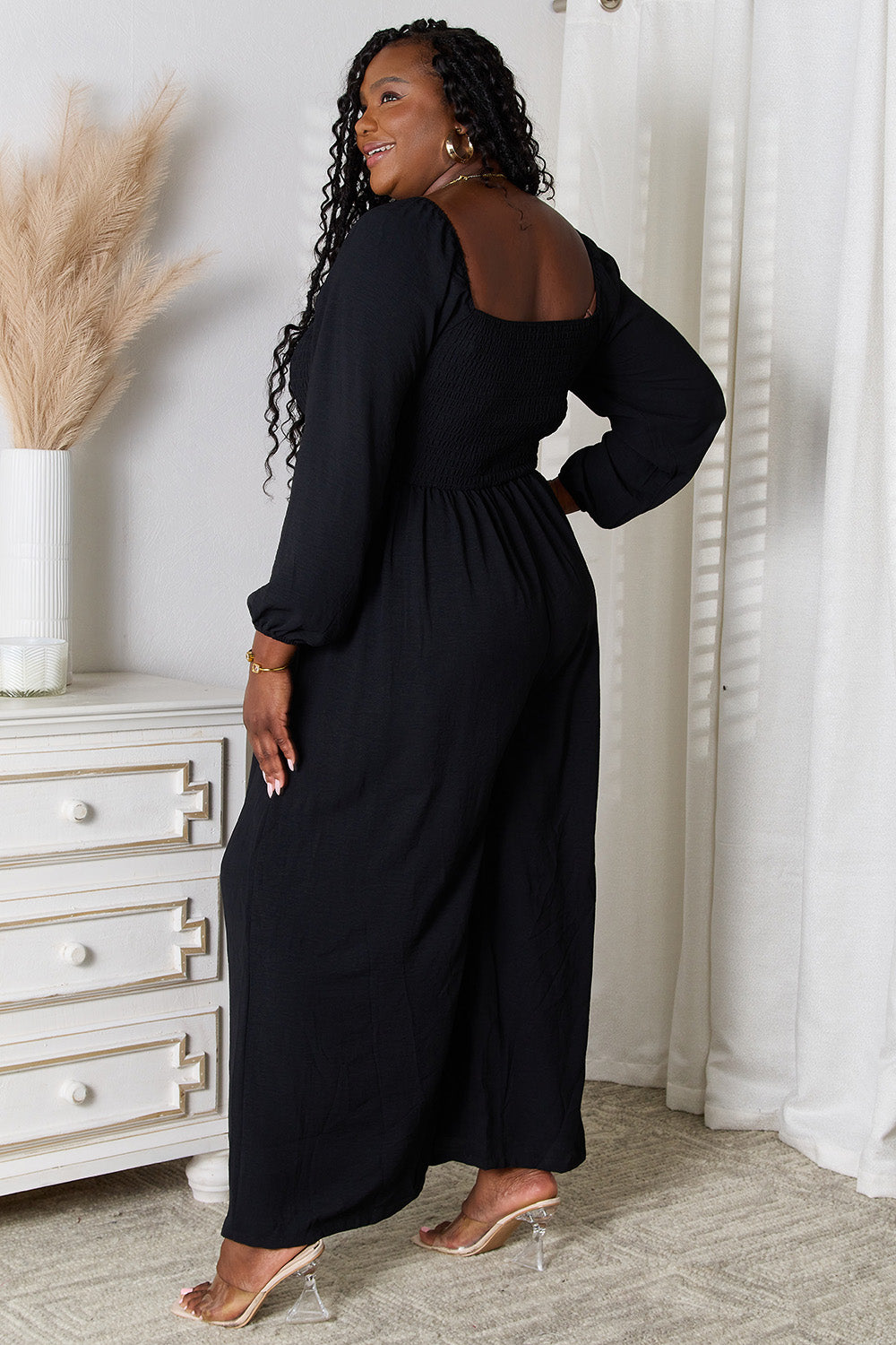 Black Trendsi Double Take Square Neck Jumpsuit with pockets, featuring a fitted bodice and wide-leg pants.